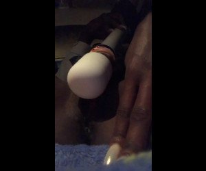 Ebony girl masturbates with magic wand in car